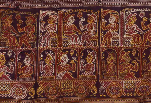 A purple, silver and gold magnified sari border with an elaborate design of a steam engine carriage showing six people holding flowers, birds and looking at each other.